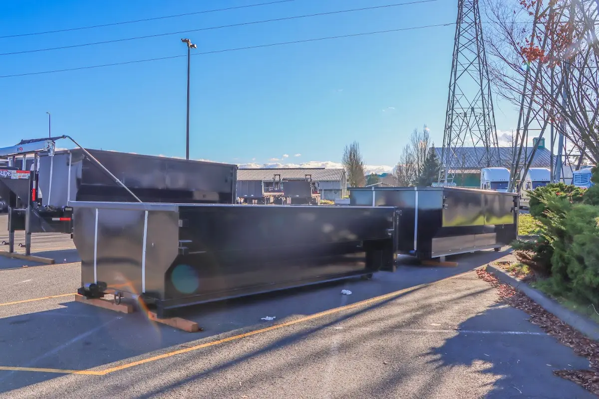 Roll-off dumpster ready for waste disposal at job site for Concrete Dumpster Rental in Benton Harbor